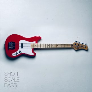 A red Bronco-style short scale bass on a white background